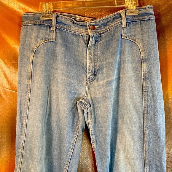 Vintage 1970’s bell bottom faded jeans. Ste. Lucien 36” waist. X belt loop.